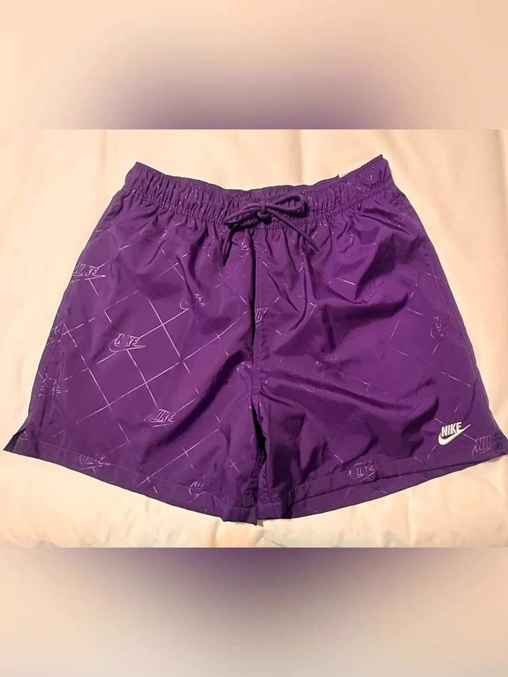 Nike Men's Purple Athletic Shorts with Subtle Logo Pattern